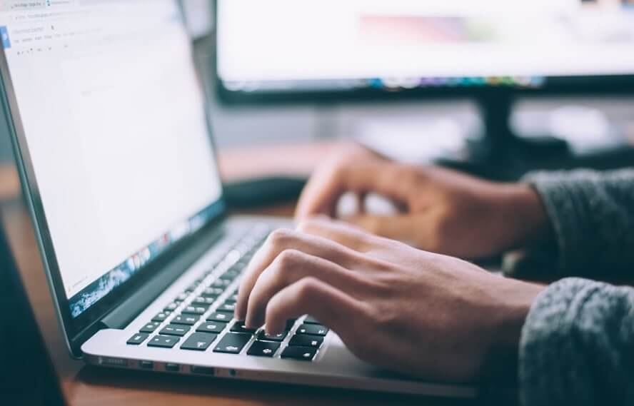 Person typing on a laptop